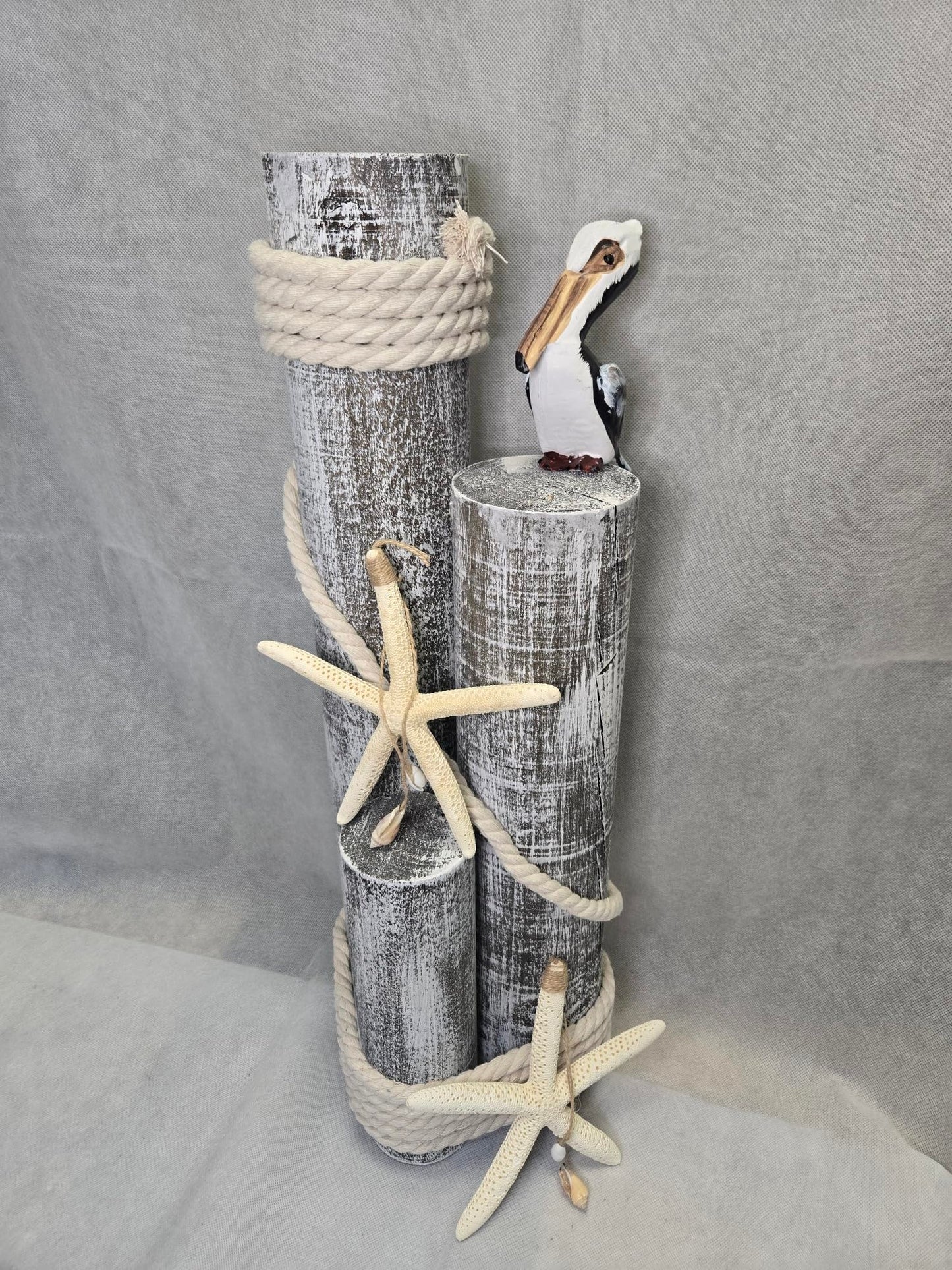 Pelican on Wood Pilings Nautical Statue with Hanging Starfish – Coastal Decor for Porch, Garden, or Poolside - Marine Bird Sculpture - Nautical Décor