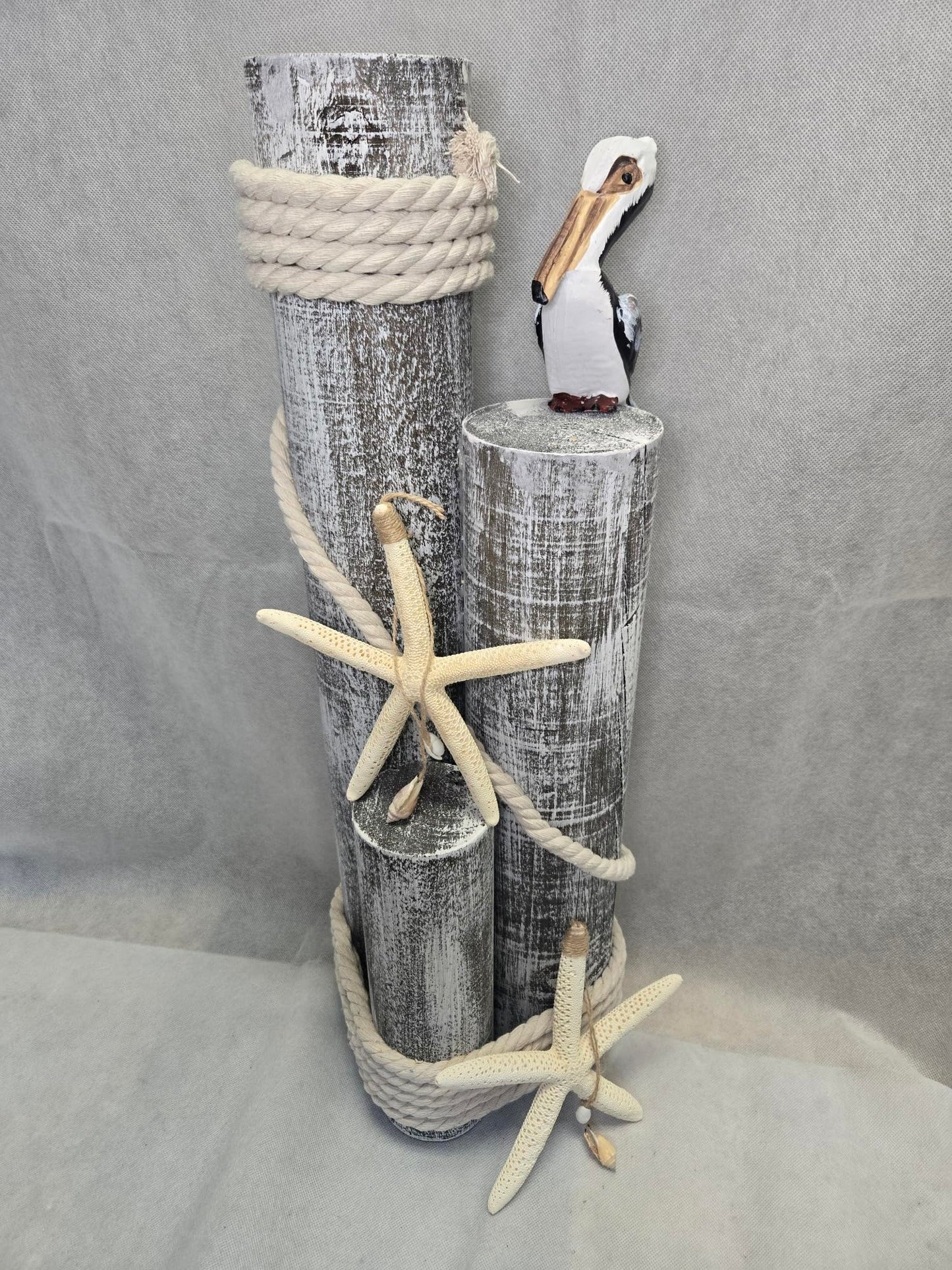 Pelican on Wood Pilings Nautical Statue with Hanging Starfish – Coastal Decor for Porch, Garden, or Poolside - Marine Bird Sculpture - Nautical Décor